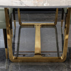 Minimalist stainless steel and Faux marble table design with luxurious golden accents.