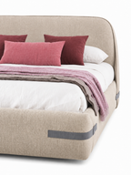 The Norvella Bed — Luxury Curved Upholstered Bed with Signature Strap Detailing